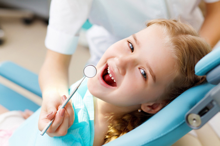 Young child receiving dental work in a comfortable and caring environment.