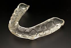 Night guard used to prevent tooth grinding during sleep.